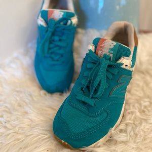 Teal New Balance tennis shoe